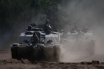 FILE PHOTO: British Army soldiers from Badger Squadron, The Royal Tank Regiment part of the 12th Armoured Brigade Combat Team ride Challenger 2 tanks during Exercise Immediate Response as one component of NATO’s Exercise Steadfast Defender 2024, in Drawsko Pomorskie training area, Poland May 15, 2024. REUTERS/Kacper Pempel/File Photo