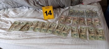 U.S. dollar bills seized by the Costa Rica's Judicial Investigation Organization (OIJ) are pictured during a raid against a major crime organization specialized in trafficking Colombian cocaine and money laundering, at an undisclosed location in Costa Rica May 25, 2021. Costa Rica's Judicial Investigation Organization (OIJ)/Handout via REUTERS ATTENTION EDITORS - THIS IMAGE HAS BEEN SUPPLIED BY A THIRD PARTY. NO RESALES. NO ARCHIVES