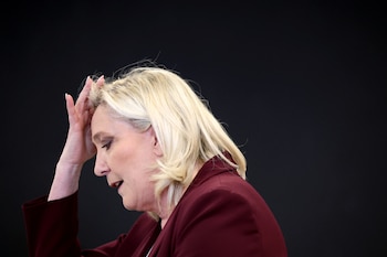 Marine Le Pen, French far-right National Rally (Rassemblement National) party candidate for the 2022 French presidential election, gestures as she speaks during a news conference on democracy and the exercise of power in Vernon, France, April 12, 2022. REUTERS/Sarah Meyssonnier