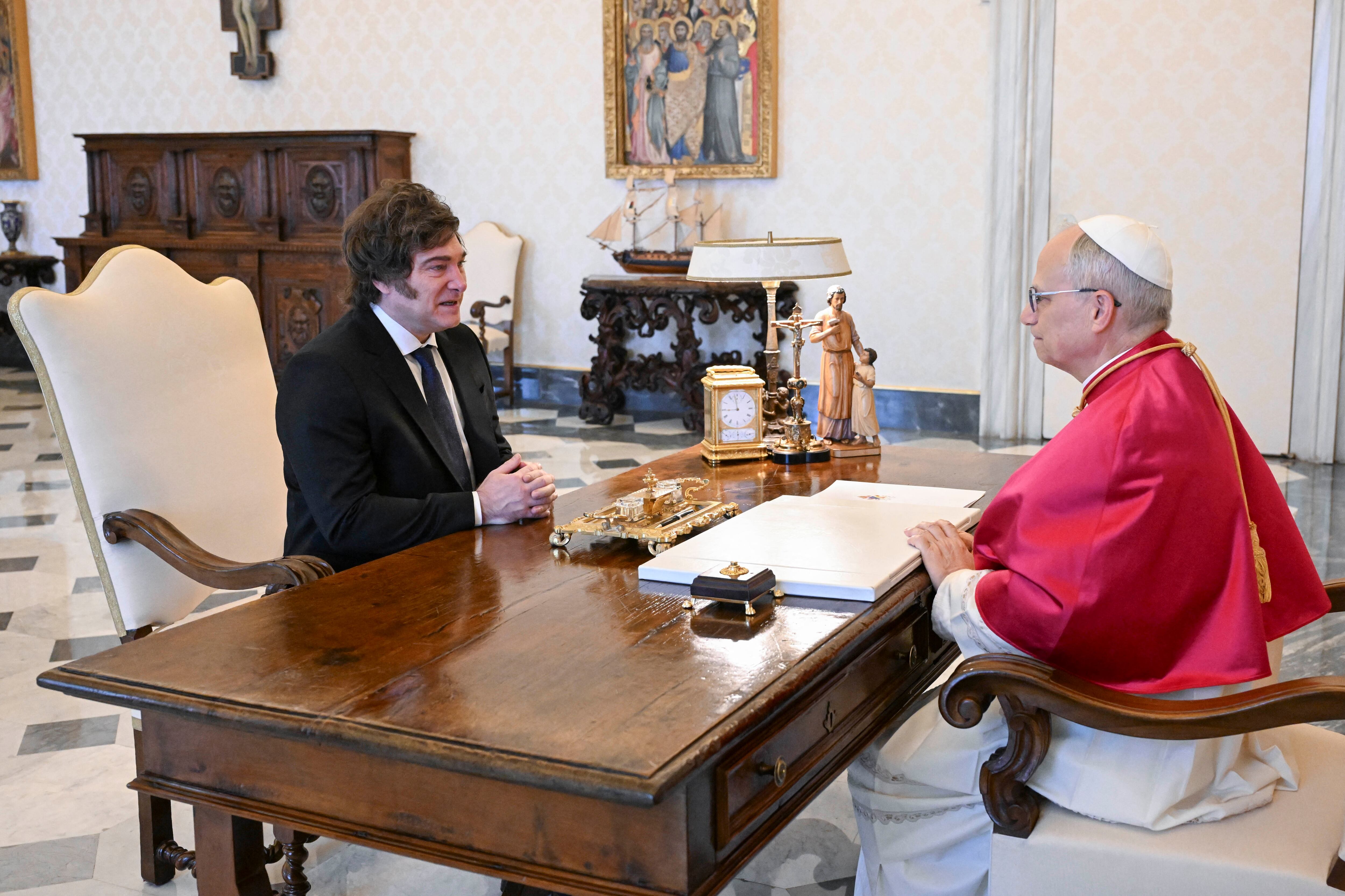 This handout photograph taken and released on June 7, 2025, by Vatican Media shows Pope Leo XIV (R) meeting with Argentina