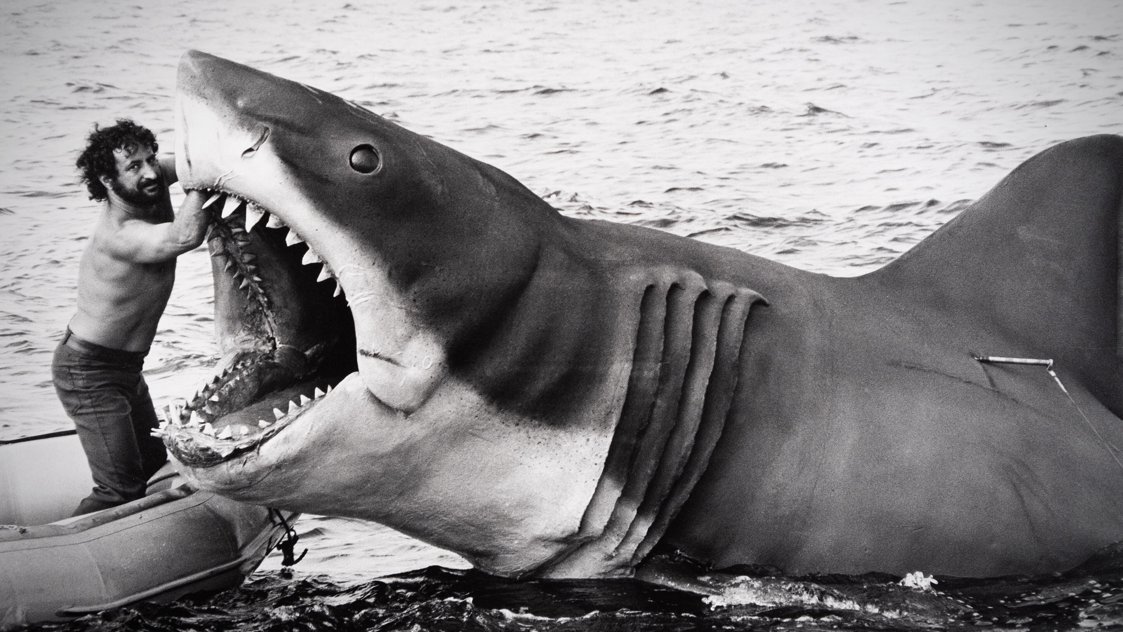 A crew member works on the mechanical shark on the set of Jaws. (Courtesy of Universal Studios Licensing LLC)