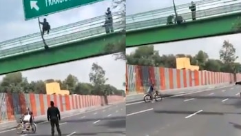 El heroico momento en el que policías salvan a joven de aventarse de un puente en CDMX