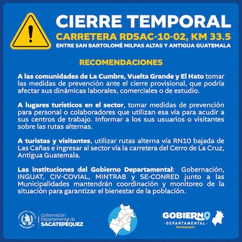 Un cartel azul con un triángulo de advertencia amarillo. El texto indica un cierre temporal de carretera y recomendaciones para el tránsito