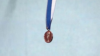 La medalla de campeón en