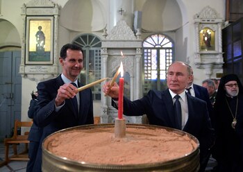 Vladimir Putin junto a Bashar