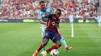 May 18, 2024; Sandy, Utah, USA; Colorado Rapids midfielder Cole Bassett (23) and Real Salt Lake midfielder Andres Gomez (11) fight for a ball during the first half at America First Field. Mandatory Credit: Rob Gray-USA TODAY Sports
