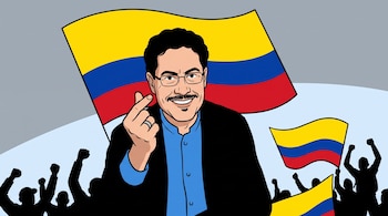 Caricatura de un hombre con bigote, barba y gafas, haciendo un corazón coreano con los dedos, frente a varias banderas de Colombia y siluetas de una multitud.