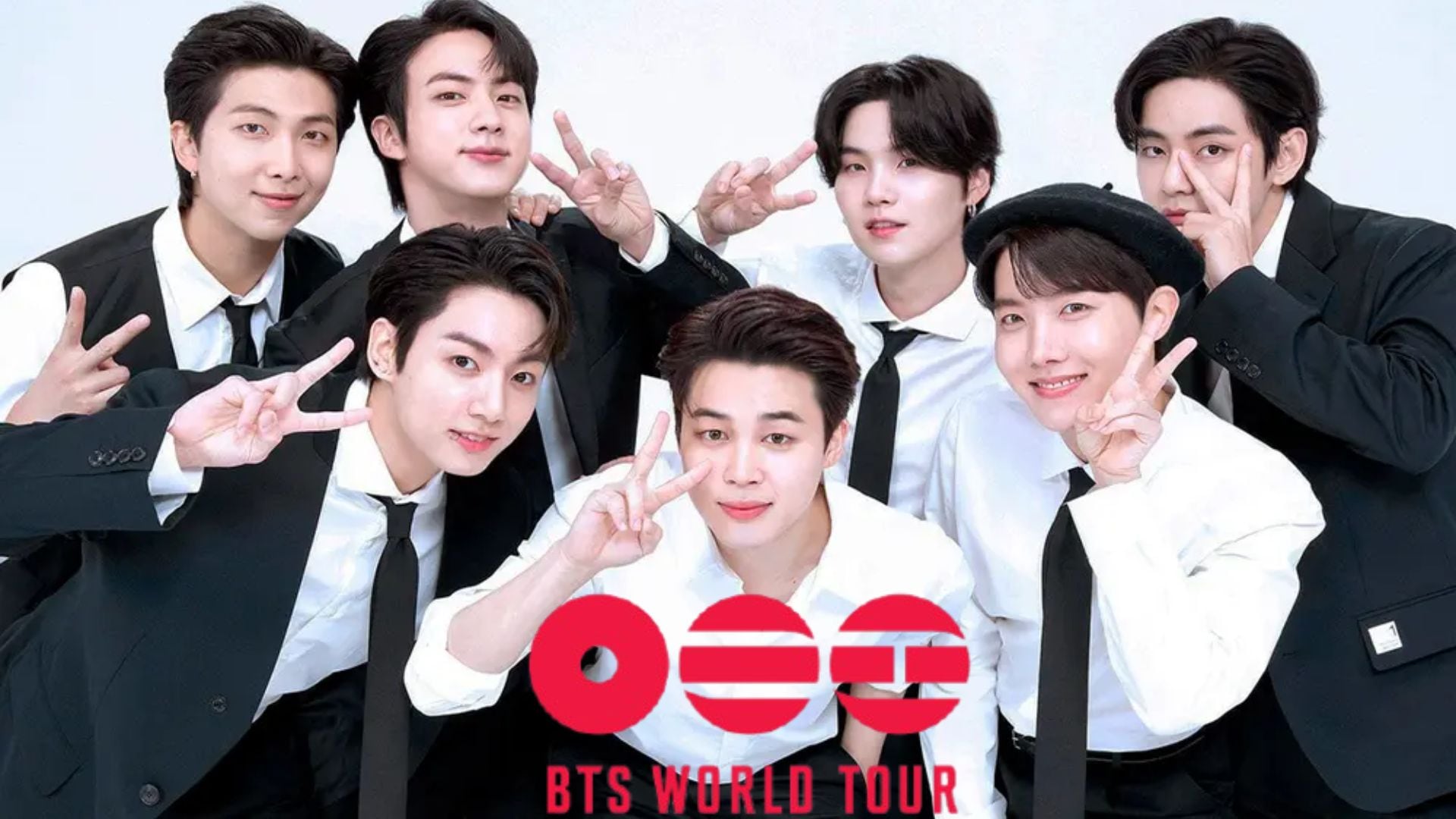 Los siete integrantes de la banda surcoreana BTS posan vestidos de traje formal para una imagen promocional de su gira mundial.