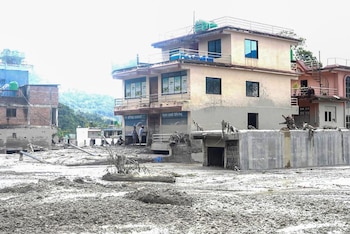 NUWAKOT, NEPAL, AUGUST 26, 2026: Houses and other structures in Trishuli Devighat Bazaar, Nuwakot, are seen damaged following flooding in the Bhotekoshi River in Rasuwa. Photo by Gopal Dahal / JNA Press.