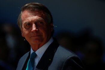 FILE PHOTO: Brazil's President Jair Bolsonaro looks on during a welcoming ceremony to receive Brazilians and foreigners evacuated from Ukraine during a repatriation mission, at Brasilia Air Base, in Brasilia, Brazil March 10, 2022. REUTERS/Adriano Machado/File Photo