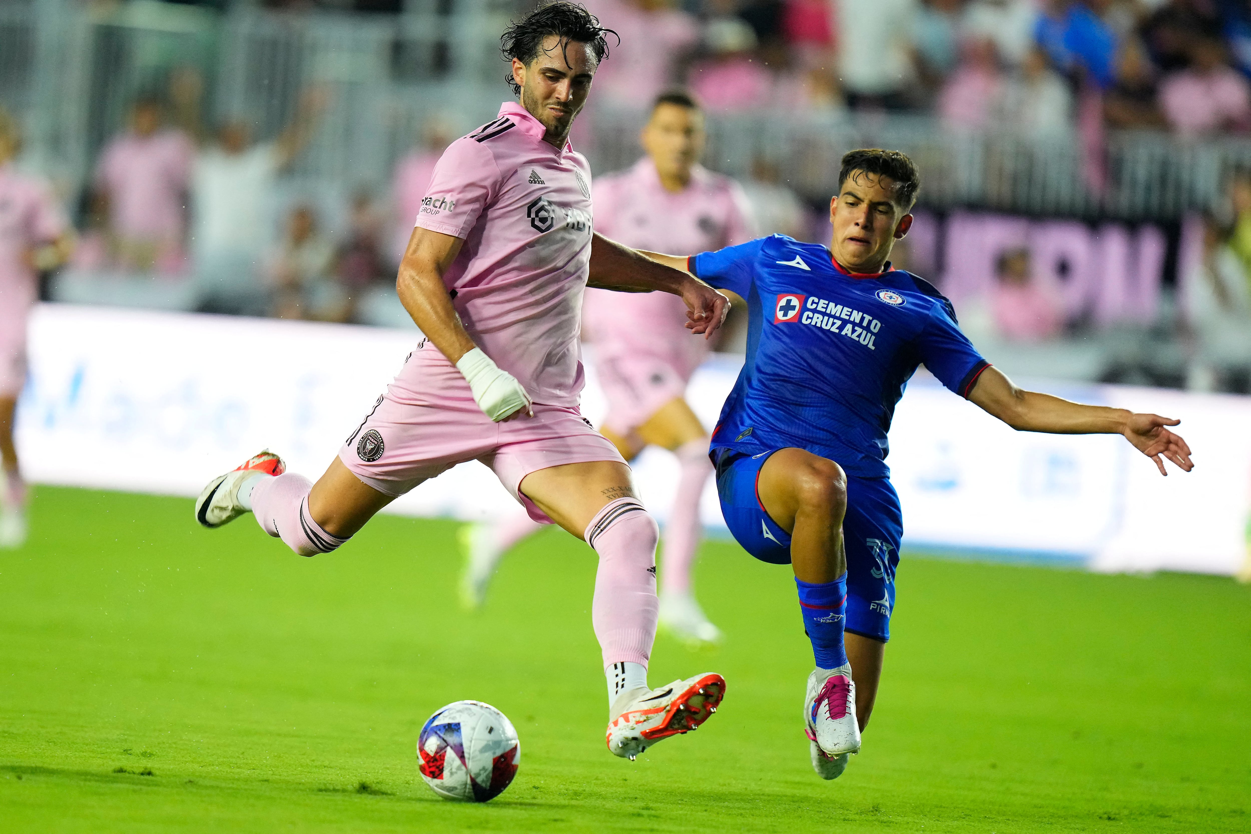 Jul 21, 2023; Fort Lauderdale, FL, USA; Cruz Azul defender Rafael Guerrero (33) moves in for the ball against Inter Miami CF forward Leonardo Campana (9) during the first half at DRV PNK Stadium. Mandatory Credit: Rich Storry-USA TODAY Sports