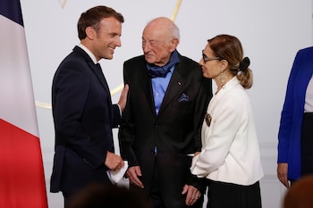 French President Emmanuel Macron greets French philosopher and sociologist Edgar Morin and his wife Sabah Abouessalam during a ceremony to mark Morin's 100th birthday at the Elysee Palace in Paris, France July 08, 2021. Yoan Valat/ Pool via REUTERS