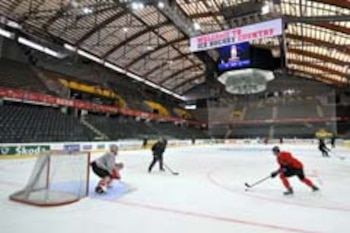 German team players practice at Bern's Ice Hockey stadium on the eve of the opening day of the 2009 IIHF Ice Hockey World Championships on April 23, 2009. Defending champions Russia face a tough fight from hungry pretenders as the top 16 national teams square off in Switzerland for the annual world ice hockey championship. The title winner will be decided in the final match on May 10 in Bern. AFP PHOTO / FABRICE COFFRINI (Photo credit should read FABRICE COFFRINI/AFP/Getty Images)