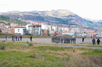 Police officers stand guard on