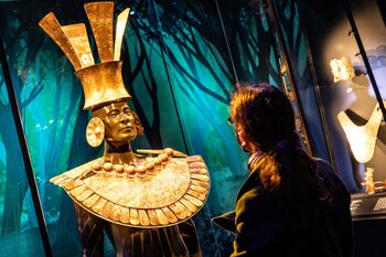 A visitor looks at artworks