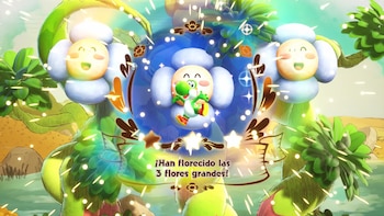 Yoshi, el dinosaurio verde, salta en el centro de una flor azul y blanca. Dos flores sonrientes lo flanquean. El texto dice: '¡Han florecido las 3 flores grandes!'