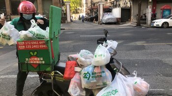 FILE - A delivery man