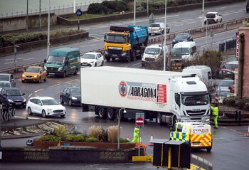 A truck driver hands over