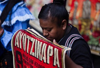 A student of Ayotzinapa holds