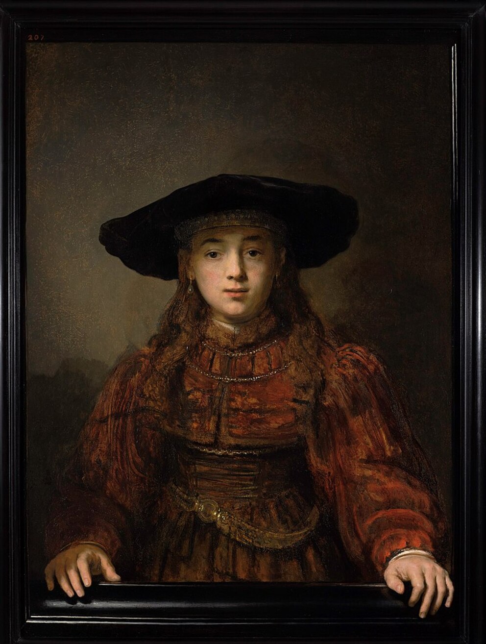 Mujer joven en un marco Rembrandt