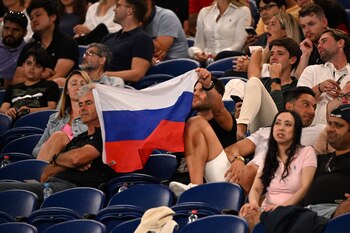 Russian fans carry their flag