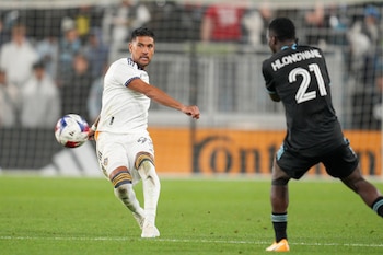 Oct 7, 2023; Saint Paul, Minnesota, USA; Los Angeles Galaxy defender Tony Alfaro (93) passes the ball against Minnesota United forward Bongokuhle Hlongwane (21) in the second half at Allianz Field. Mandatory Credit: Matt Blewett-USA TODAY Sports