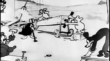 Dibujo animado en blanco y negro mostrando a un grupo de animales, incluyendo un ratón y patos, usando martillos para construir una estructura con ruedas
