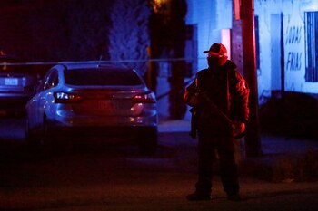 A policeman guards a crime