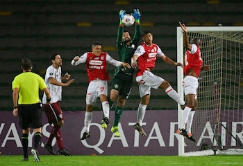 Soccer Football - Copa Libertadores - Group D - Santa Fe v Fluminense - Estadio Centenario, Armenia, Colombia - April 28, 2021 Fluminense's Marcos Felipe in action with Santa Fe's Diego Valdes and Jeisson Palacios Pool via REUTERS/Luis Robayo