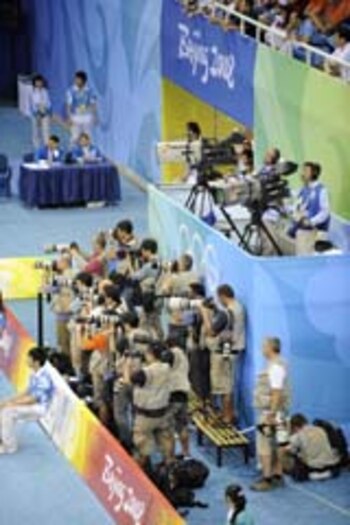 This general view shows photographers