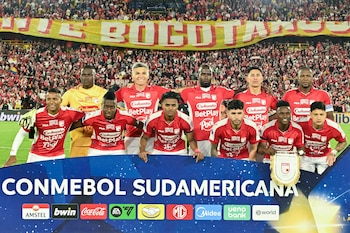 Santa Fe players pose for pictures ahead of the first leg of the Copa Sudamericana round of 16 football match between Colombia's Independiente Santa Fe and Argentina's River Plate at the Nemesio Camacho 'El Campin' stadium, in Bogota, on August 19, 2026. (Photo by Luis ACOSTA / AFP)