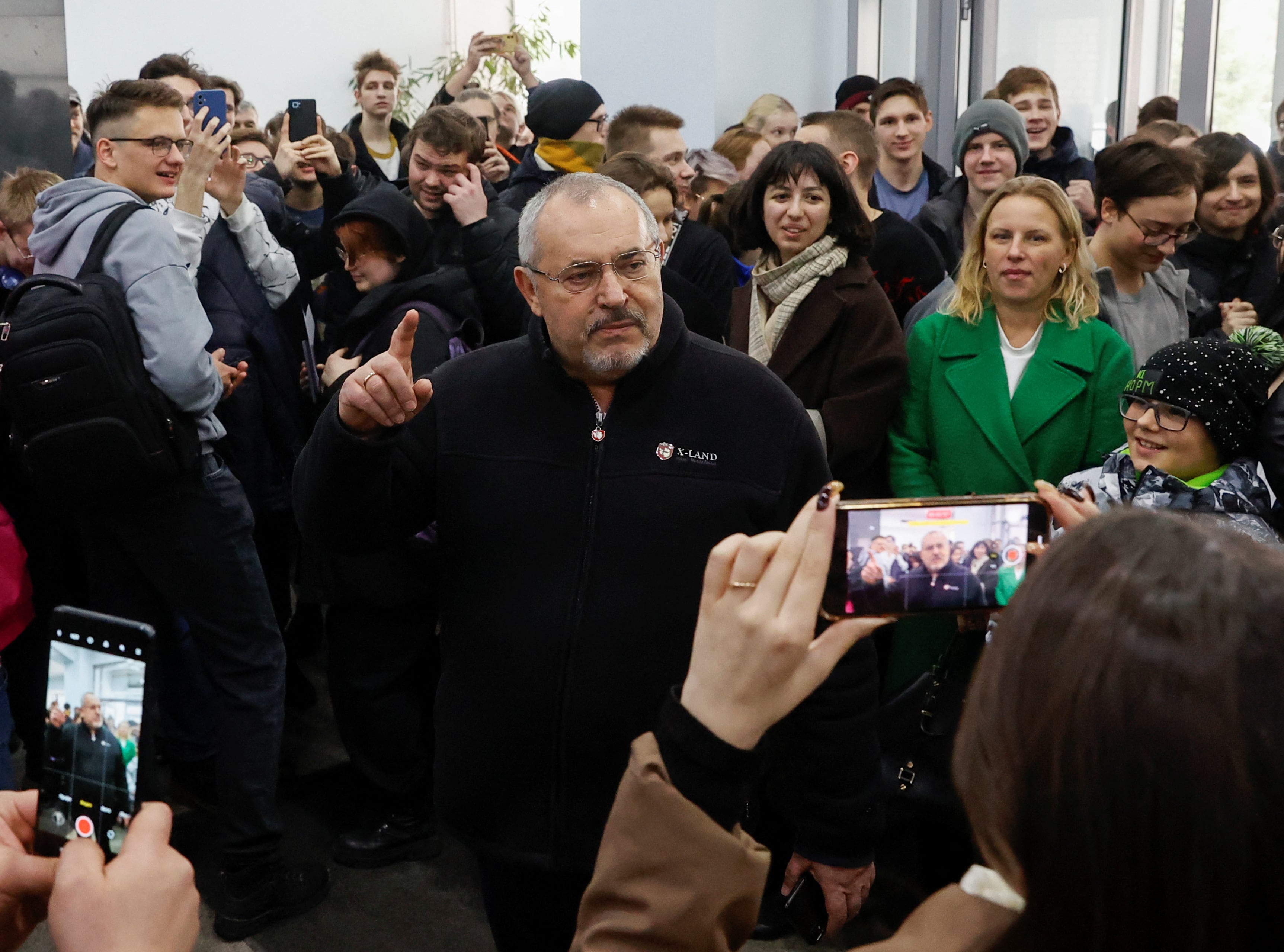 Boris Nadezhdin, an anti-war candidate who was barred from running in the election, meets students after voting on the final day of the presidential election in Dolgoprudny, Moscow region, Russia March 17, 2024. REUTERS/Stringer