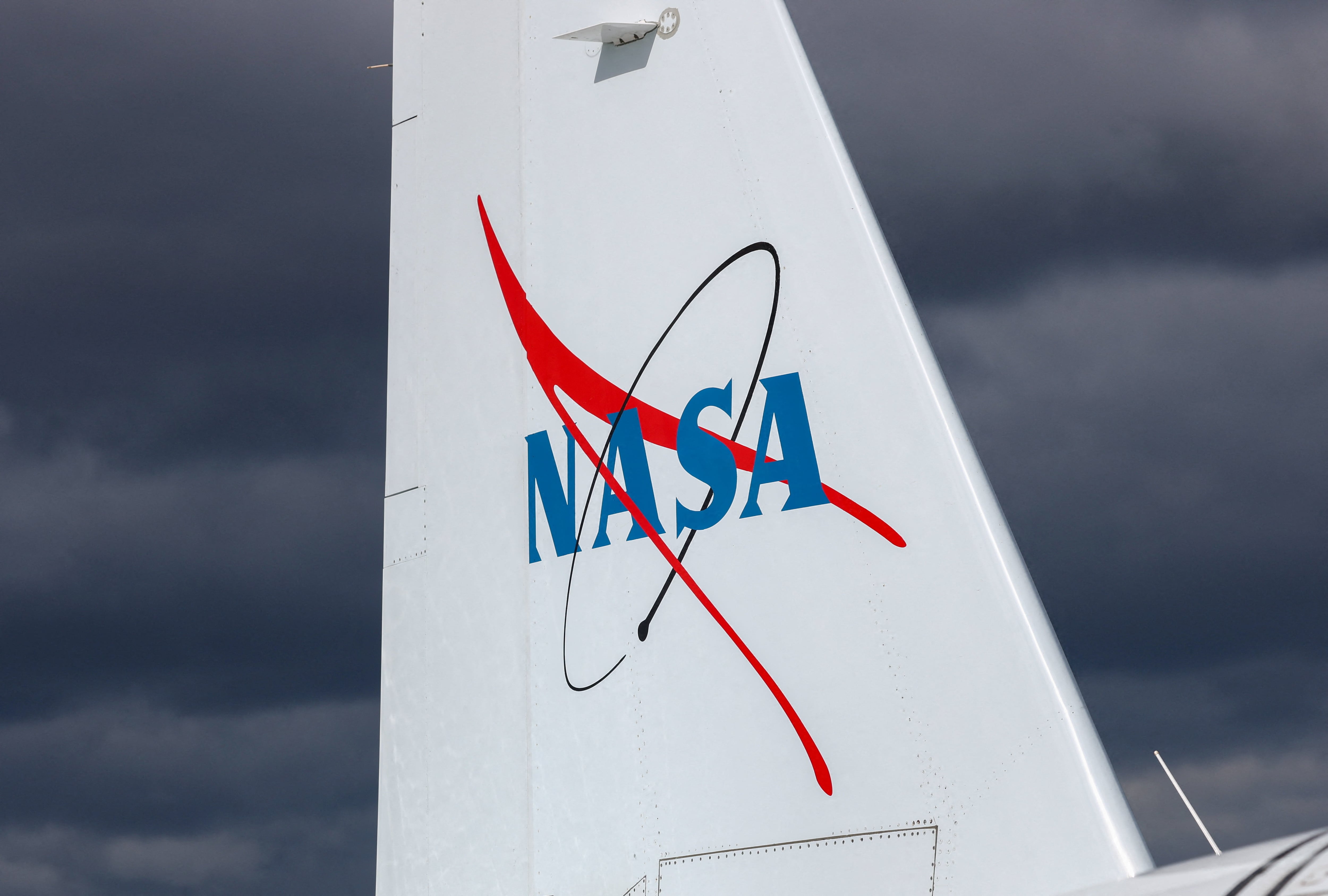 A NASA logo on a WB-57 Canberra aircraft ahead of a NASA-supported mission to fly a high-altitude aircraft above the clouds during a total solar eclipse to study the Sun and changes in the Earth's atmosphere in Keflavik, Iceland, August 11, 2026. REUTERS/Denis Balibouse