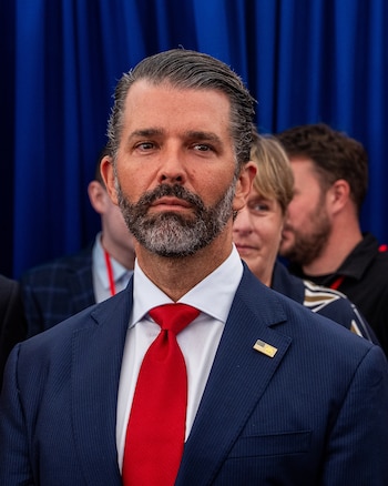 Donald Trump Jr. listens as his father, President Donald Trump, speaks at the Deerfield Residence in Dublin, Sept. 12, 2026. A Russian businessman with ties to the Kremlin paid hundreds of thousands of dollars to help finance Donald Trump Jr.Õs wedding after-party in the Bahamas this year, according to two people with knowledge of the matter. (Alex Kent/The New York Times)