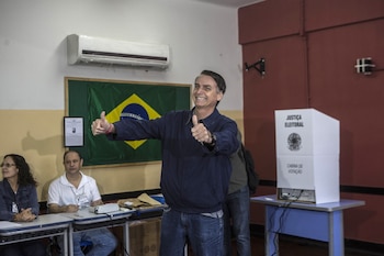 Jair Bolsonaro gives a thumbs