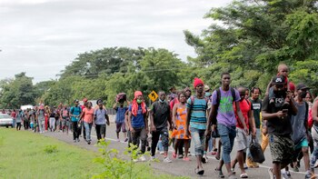 With a cross in tow,