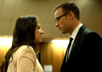 PRETORIA, SOUTH AFRICA - APRIL 07: (SOUTH AFRICA OUT) Oscar Pistorius speaks with his sister Aimee Pistorius at the Pretoria High Court on April 7, 2014, in Pretoria, South Africa. Pistorius, stands accused of the murder of his girlfriend, Reeva Steenkamp, on February 14, 2014. This is Pistorius' official trial, the result of which will determine the paralympian athlete's fate. (Photo by Deaan Vivier - Pool/Getty Images)