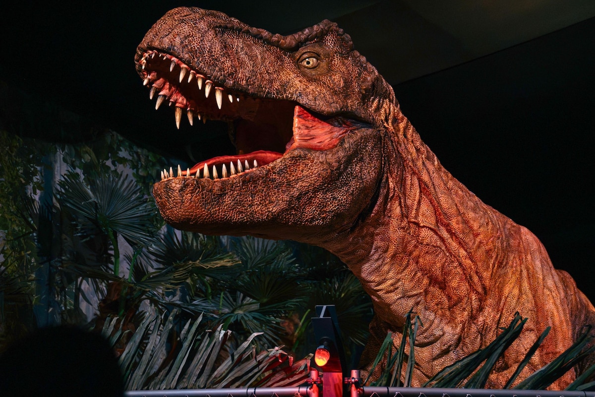 Families exploring the prehistoric landscape at the Jurassic World exhibition in ALRIO