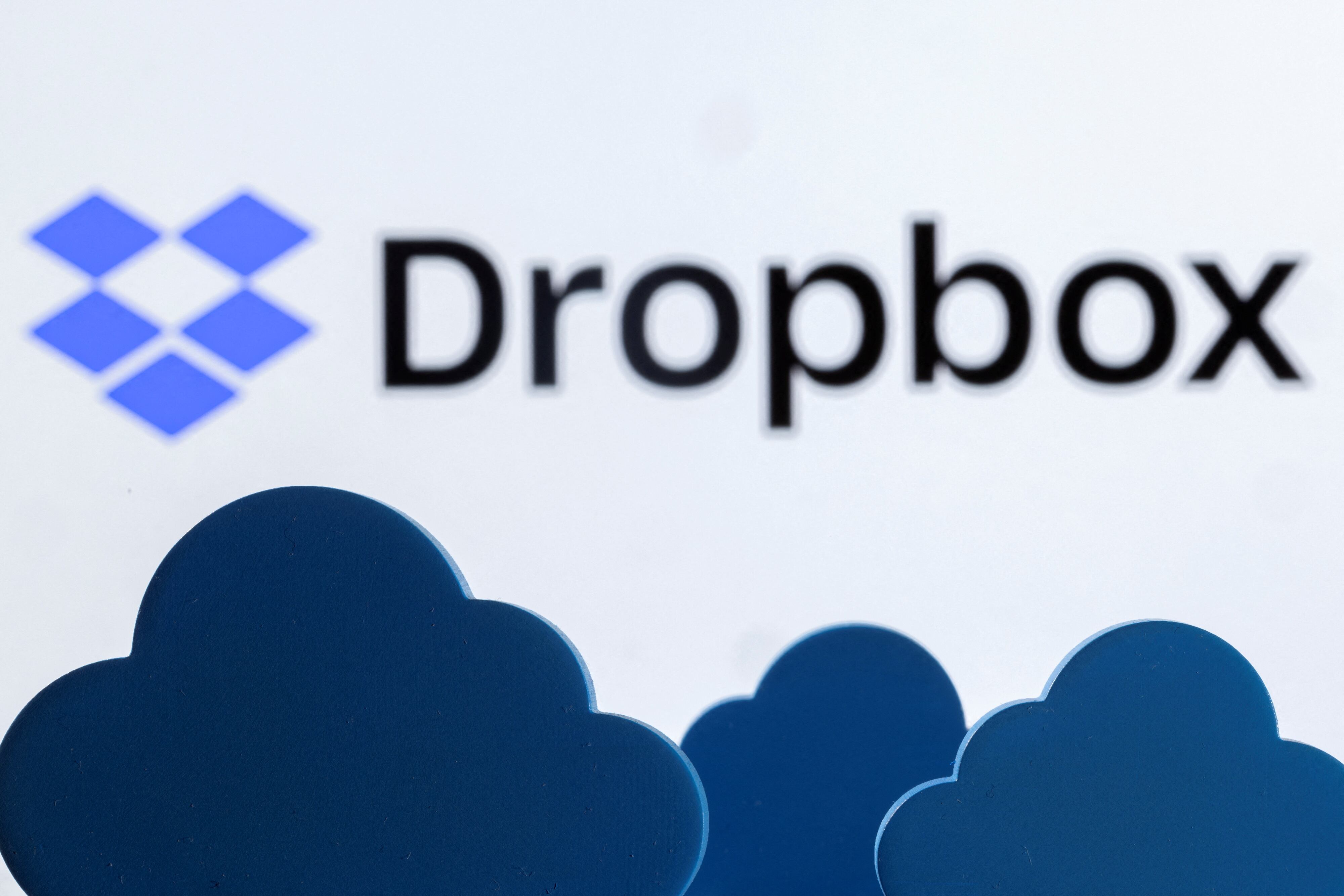Clouds are seen in front of the Dropbox logo in this illustration taken February 27, 2022. REUTERS/Dado Ruvic/Illustration