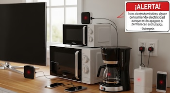 Un televisor, dos microondas, una cafetera, teléfonos móviles y dispositivos enchufados en una cocina. Un cartel rojo con texto blanco de alerta.