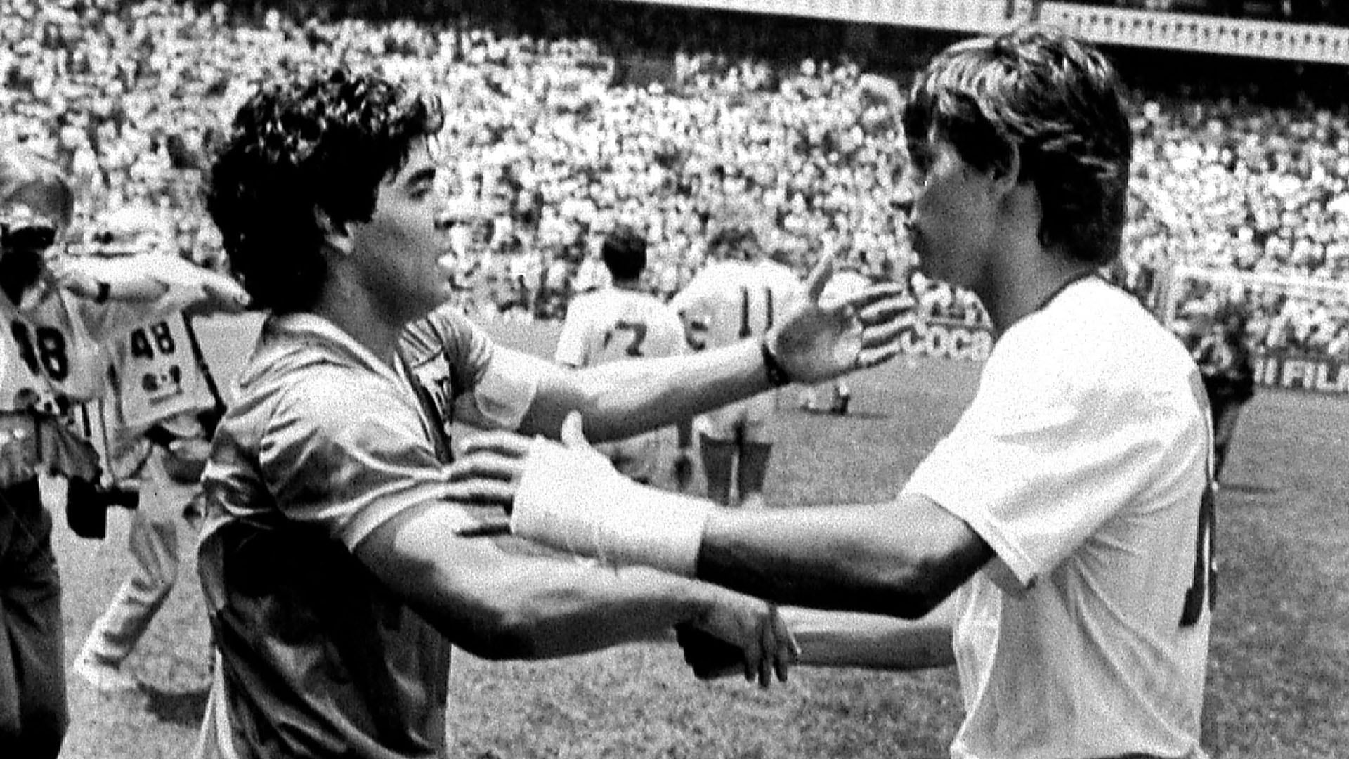 Argentine World Cup star Diego Maradona (L) is greeted by England