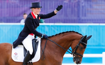 FILE PHOTO: Zara Phillips of Britain riding High Kingdom waves after performing during the equestrian Eventing Individual Dressage Day 2 in the Greenwich Park during the London 2012 Olympic Games, July 29, 2012. REUTERS/Mike Hutchings/File Photo