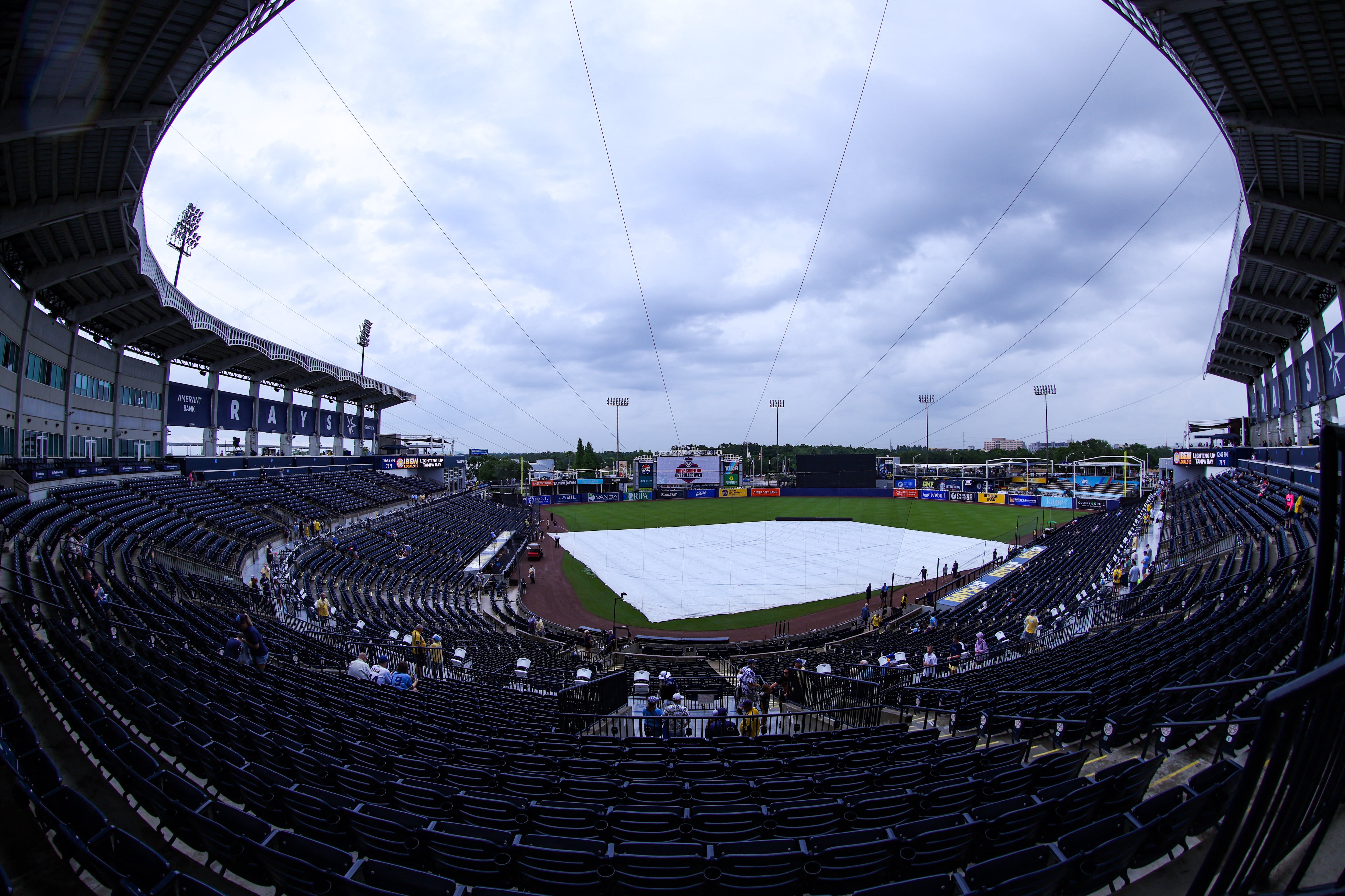 May 11, 2025; Tampa, Florida, USA; a tarp lines the infield before a game between the Tampa Bay Rays and the Milwaukee Brewers at George M. Steinbrenner Field. Mandatory Credit: Nathan Ray Seebeck-Imagn Images