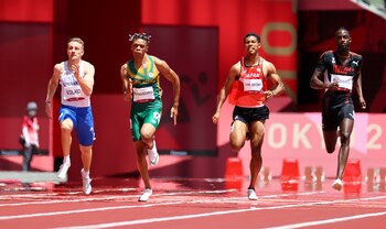 Tokyo 2020 Olympics - Athletics - Men's 200m - Round 1 - Olympic Stadium, Tokyo, Japan - August 3, 2021. Jereem Richards of Trinidad & Tobag, Abdul Hakim Sani Brown of Japan, Phatutshedzo Maswanganyi of South Africa and Jan Volko of Slovakia in action in Heat 2 REUTERS/Lucy Nicholson