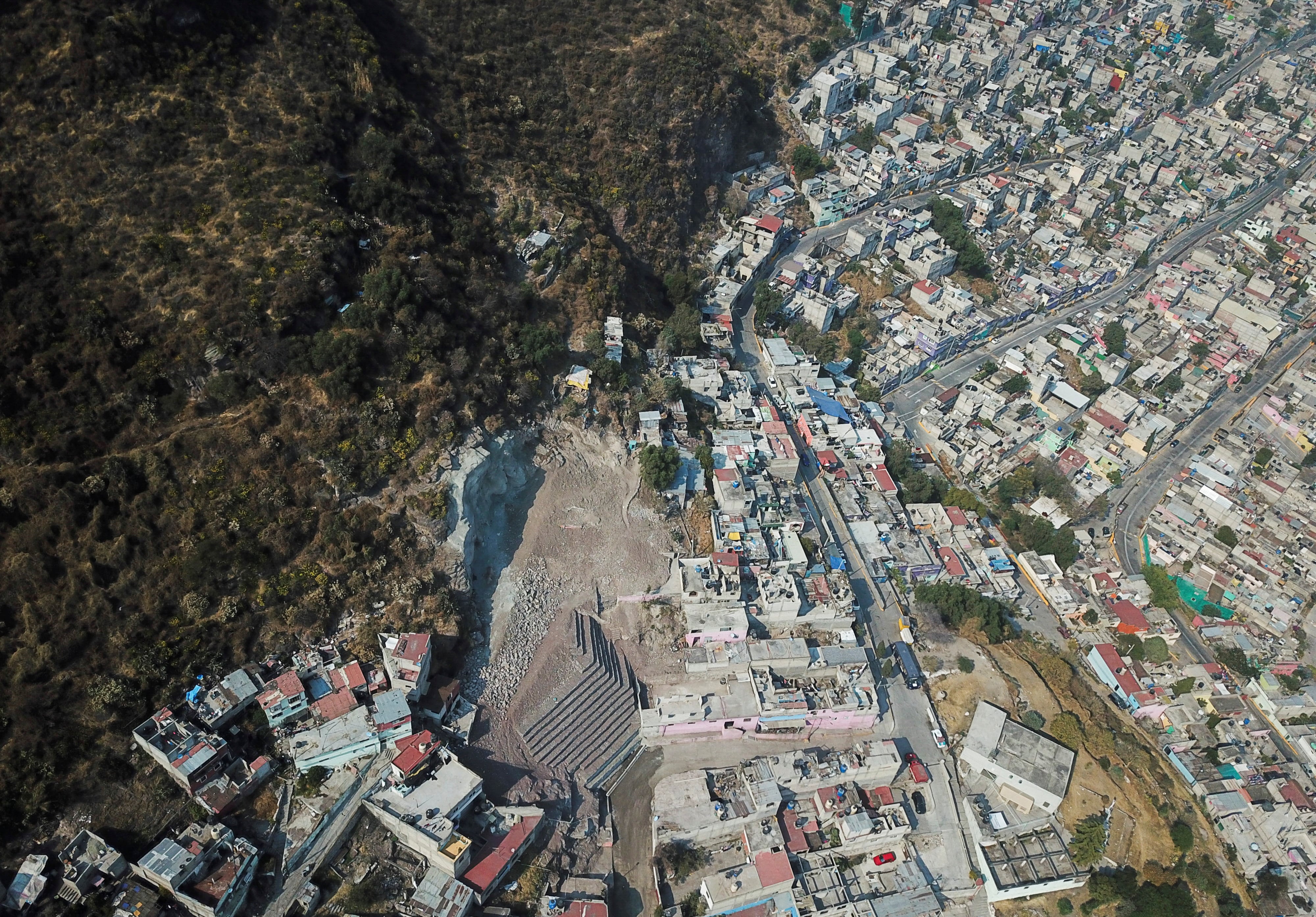 An aerial view shows an area hit by a landslide on September 10, caused by heavy rains and an earthquake that loosened the hillside, at the Cerro del Chiquihuite, in the municipality of Tlalnepantla de Baz, Mexico December 8, 2021. Picture taken December 8, 2021. Picture taken with a drone. REUTERS/Luis Cortes
