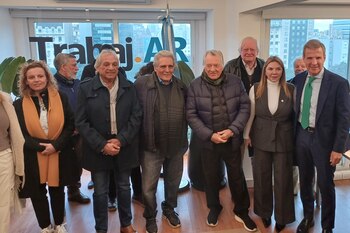 Luis Barrionuevo, con Martín Redrado,