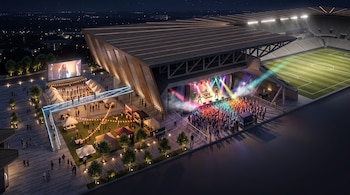 Ilustración tridimensional de un estadio con cancha de fútbol, escenario de música en vivo con público, plaza con carpas e iluminación nocturna.
