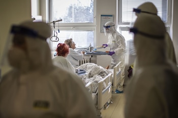 Healthcare workers serve lunch to