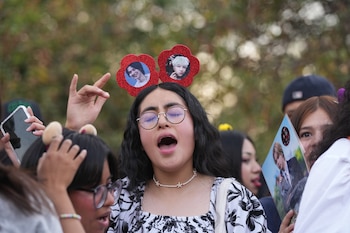 A fan sings while waiting for the start the South Korean band BTS concert, in Mexico City, Thursday, May 7, 2026. (AP Photo/Fernando Llano)