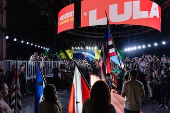 FILE — Attendees hold up their phones during the launch event for President Luiz Inácio Lula da Silva’s presidential reelection campaign in São Paulo, Aug. 2, 2026. Luiz Inácio Lula da Silva, the leftist incumbent, and Flávio Bolsonaro, the right-wing challenger, face off in a race that could define the future of Latin America. (Victor Moriyama/The New York Times)